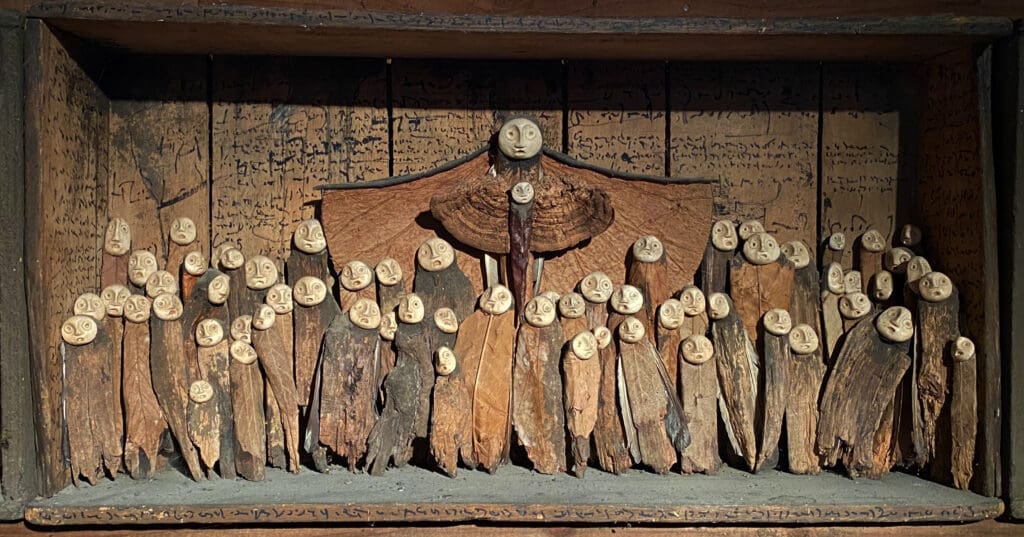 Un tableau de Jephan de Villiers empli des petits personnages du peuple d'Arbonie